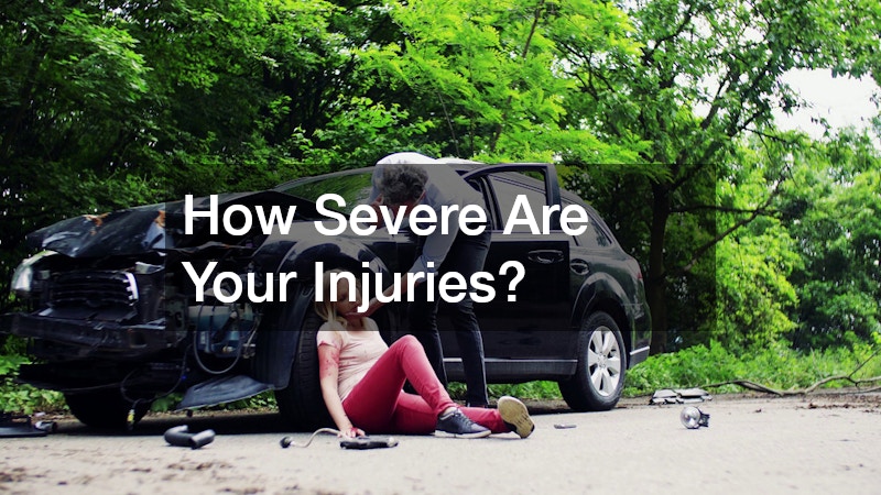 an injured woman being tended by a man after a car accident